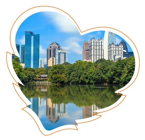 The image shows a heart-shaped graphic with a city skyline featuring buildings and a river in the foreground, under a blue sky with clouds, suggesting an urban landscape.