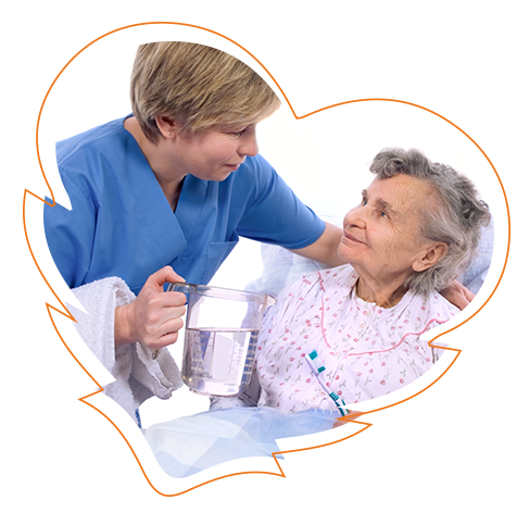 The image features a woman in a blue uniform, who appears to be a nurse, assisting an elderly person who is seated in a wheelchair, with a gentle smile on her face.