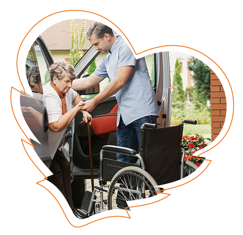 The image shows a man assisting an elderly woman with mobility challenges, likely at a curb.